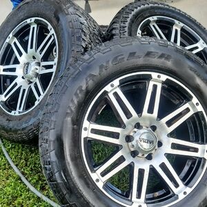 Set of Black and Silver Wrangler Tires with Rims
